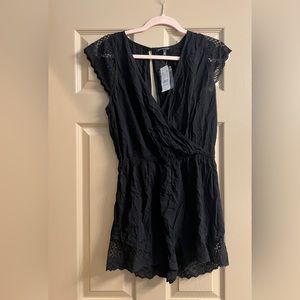 Unused Kendall & Kylie black linen romper from pacsun with tag attached.